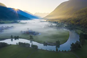 Mist over the cultivated fields along Stryneelva river, aerial view, Stryn, Nordfjorden Mist over the cultivated fields along Stryneelva river, aerial view, Stryn, Nordfjorden