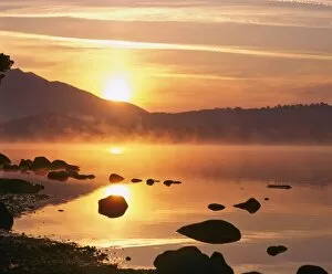 Images Dated 25th September 2008: Mist rising on Derwent Water at sunrise, Lake District National Park, Cumbria