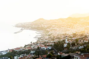 Mist at sunset over Funchal Bay and city viewed from Sao Goncalo, Madeira island Mist at sunset over Funchal Bay and city viewed from Sao Goncalo, Madeira island