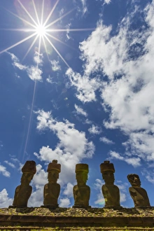 Moai with scoria red topknots at the restored ceremonial site of Ahu Nau Nau on Easter Island (Isla de Pascua) Moai with scoria red topknots at the restored ceremonial site of Ahu Nau Nau on Easter Island (Isla de Pascua)