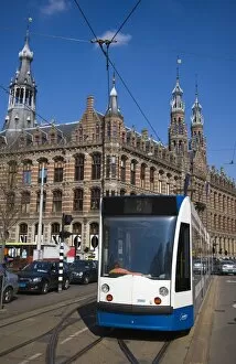 Images Dated 9th April 2008: Modern tram with the Magna Plaza building behind, Amsterdam, Netherlands, Europe