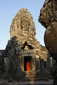 Sun Lit Gallery: Monk at the Bayon temple, Angkor Thom Complex, Angkor, UNESCO World Heritage Site