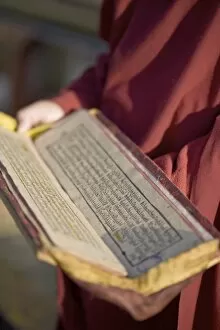 Images Dated 9th October 2008: Monk holding Buddhist prayer book, Rumtek Gompa, Gangtok, Sikkim, India, Asia