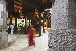 Monk walking in Temple of the Tooth (Sri Dalada Maligawa), Kandy, Sri Lanka, Asia Monk walking in Temple of the Tooth (Sri Dalada Maligawa), Kandy, Sri Lanka, Asia