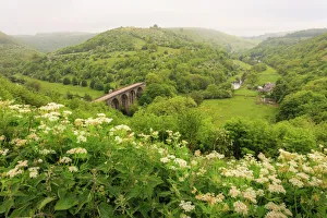 Monsal Trail crosses Monsal Dale on Monsal Head viaduct, limestone dale scenery in summer Monsal Trail crosses Monsal Dale on Monsal Head viaduct, limestone dale scenery in summer