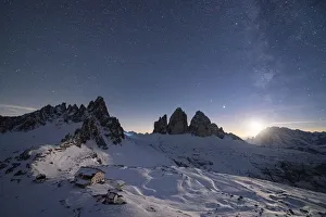 Monte Paterno, Tre Cime di Lavaredo and Rifugio Locatelli hut lit by moon Monte Paterno, Tre Cime di Lavaredo and Rifugio Locatelli hut lit by moon