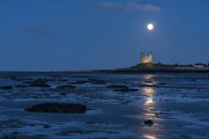 Full moon rising over Reculver Towers, beach at low tide, Reculver, Herne Bay, Kent Full moon rising over Reculver Towers, beach at low tide, Reculver, Herne Bay, Kent