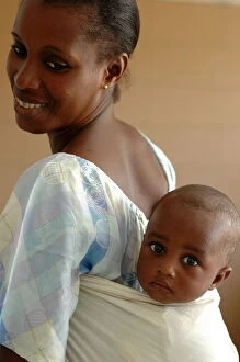 Mother carrying her baby on her back, Dakar, Senegal, West Africa, Africa