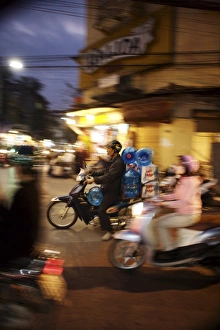 Motor cyclist carrying water bottles in traffic, Vietnam, Indochina, Southeast Asia, Asia Motor cyclist carrying water bottles in traffic, Vietnam, Indochina, Southeast Asia, Asia