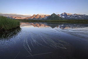 Mount Cardine and Peak Tambo are reflected in Lake Andossi at sunrise, Chiavenna Valley Mount Cardine and Peak Tambo are reflected in Lake Andossi at sunrise, Chiavenna Valley