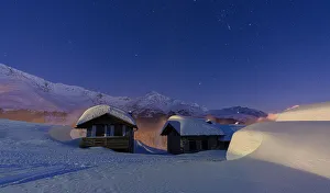 Mountain huts covered with snow during a winter starry night, Andossi, Madesimo Mountain huts covered with snow during a winter starry night, Andossi, Madesimo