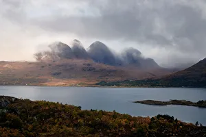 Mountains in the mist facing a lake in the Scottish Highlands, Scotland, United Kingdom Mountains in the mist facing a lake in the Scottish Highlands, Scotland, United Kingdom