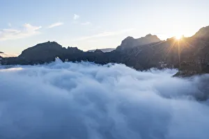 Mountains in a sea of clouds at sunset viewed from Pico Ruivo, Madeira, Portugal Mountains in a sea of clouds at sunset viewed from Pico Ruivo, Madeira, Portugal