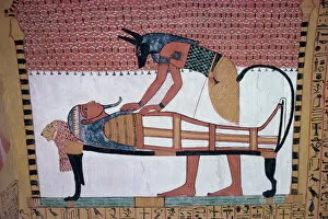 Tomb Gallery: Mural showing the god Anubis leaning over mummy of Ramses II, in the Tomb of Sinjin