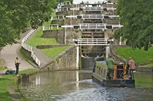 Flight Collection: Narrow boat entering the bottom lock of the five lock ladder on the Liverpool Leeds canal