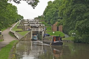 Lock Gallery: Narrow boats on the Liverpool Leeds canal, negotiating the five lock ladder at Bingley