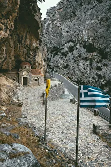 Narrow road crossing Kotsifou gorge nearby the old Agios Nikolaos chapel built in rocks Narrow road crossing Kotsifou gorge nearby the old Agios Nikolaos chapel built in rocks