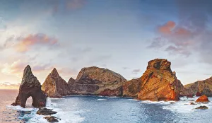 Natural arch, stone rocks and cliffs at dawn from Ponta do Rosto viewpoint Natural arch, stone rocks and cliffs at dawn from Ponta do Rosto viewpoint