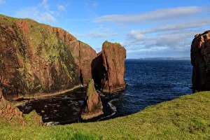 North Ham, lichen covered huge red granite cliffs and stacks, Muckle Roe Island, Shetland North Ham, lichen covered huge red granite cliffs and stacks, Muckle Roe Island, Shetland