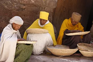 Nuns sorting wheat in Bet Maryam church courtyard, Lalibela, Wollo, Ethiopia, Africa Nuns sorting wheat in Bet Maryam church courtyard, Lalibela, Wollo, Ethiopia, Africa