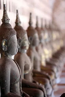 Old Buddha statues in the cloister around the Sim, Wat Sisaket (Si Saket) Buddhist temple Old Buddha statues in the cloister around the Sim, Wat Sisaket (Si Saket) Buddhist temple