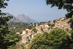 The old citadel of Evisa perched on the hill surrounded by mountains, Southern Corsica The old citadel of Evisa perched on the hill surrounded by mountains, Southern Corsica