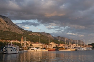 Old town with many Venetian style houses and boats in harbour, Makarska, Croatia, Europe Old town with many Venetian style houses and boats in harbour, Makarska, Croatia, Europe