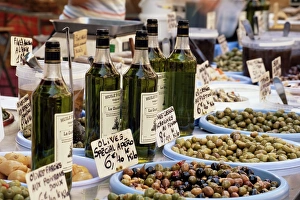 Olives and olive oil on sale at a market, Cassis, Bouches-de-Rhone Olives and olive oil on sale at a market, Cassis, Bouches-de-Rhone