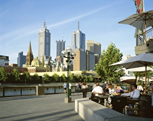 Open air cafe, and city skyline, South Bank Promenade, Melbourne, Victoria Open air cafe, and city skyline, South Bank Promenade, Melbourne, Victoria