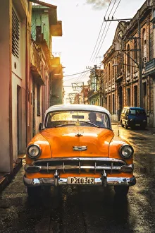 Orange American vintage car at sunset, La Habana (Havana), Cuba, West Indies, Caribbean Orange American vintage car at sunset, La Habana (Havana), Cuba, West Indies, Caribbean