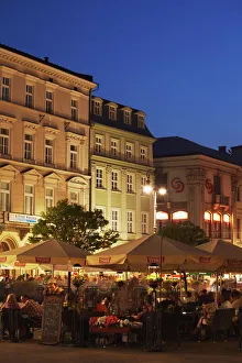 Outdoor cafes in Main Market Square (Rynek Glowny) at dusk, Krakow, Poland, Europe Outdoor cafes in Main Market Square (Rynek Glowny) at dusk, Krakow, Poland, Europe