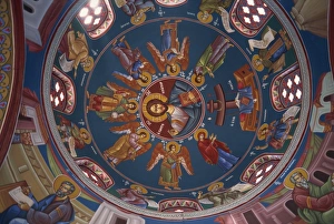 Paintings of Christian figures including Christ, in vibrant colours on the ceiling of the dome in the interior of St Paintings of Christian figures including Christ, in vibrant colours on the ceiling of the dome in the interior of St
