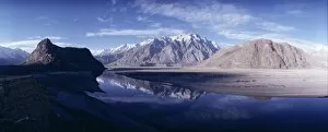 Related Images Gallery: Panorama of mountains reflected in the water of the Indus River