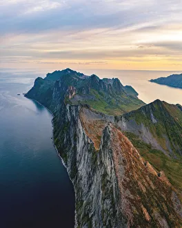Panoramic of Segla, Hesten and Inste Kongen mountains at sunrise, Senja island Panoramic of Segla, Hesten and Inste Kongen mountains at sunrise, Senja island