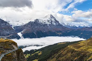 People admiring Mount Eiger from First Cliff Walk elevated walkway, Grindelwald People admiring Mount Eiger from First Cliff Walk elevated walkway, Grindelwald