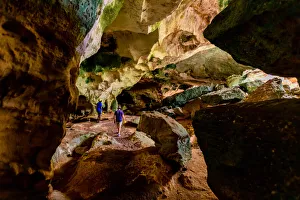 People exploring sea caves on North Caicos, Turks and Caicos Islands, Atlantic People exploring sea caves on North Caicos, Turks and Caicos Islands, Atlantic