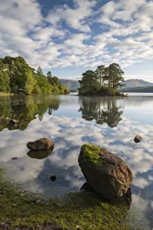 A perfect morning with reflections on Derwent Water in the Lake District National Park A perfect morning with reflections on Derwent Water in the Lake District National Park