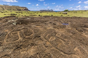 Petroglyphs carved in the lava at the 15 moai restored ceremonial site of Ahu Tongariki on Easter Island Petroglyphs carved in the lava at the 15 moai restored ceremonial site of Ahu Tongariki on Easter Island