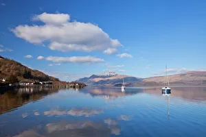 Picturesque tranquil Loch Lomond with sailing boats, Luss Jetty, Luss, Argyll and Bute Picturesque tranquil Loch Lomond with sailing boats, Luss Jetty, Luss, Argyll and Bute
