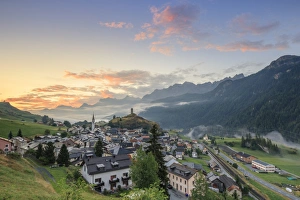 Pink clouds at dawn on the alpine village of Ardez, canton of Graub?nden, district of Inn Pink clouds at dawn on the alpine village of Ardez, canton of Graub?nden, district of Inn