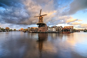 Pink clouds at sunset on the Windmill De Adriaan reflected in the River Spaarne, Haarlem Pink clouds at sunset on the Windmill De Adriaan reflected in the River Spaarne, Haarlem
