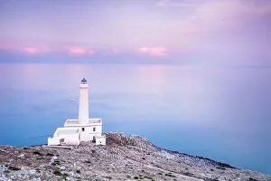 Pink sky on turquoise sea frames the lighthouse at Punta Palascia at sunset, Otranto Pink sky on turquoise sea frames the lighthouse at Punta Palascia at sunset, Otranto