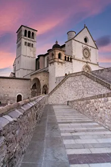 Pink sunrise over the Papal Basilica of Saint Francis in Assisi Pink sunrise over the Papal Basilica of Saint Francis in Assisi