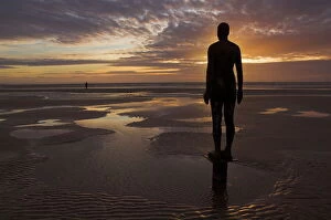 Usk Collection: Another Place statues by artist Antony Gormley on Crosby beach, Merseyside