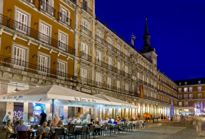 Plaza Mayor cafes at dusk, Madrid, Spain, Europe Plaza Mayor cafes at dusk, Madrid, Spain, Europe