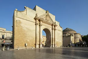 Places Of Worship Gallery: Porta Napoli and the Santa Maria di Porta church in afternoon sunlight, Lecce, Puglia, Italy, Europe