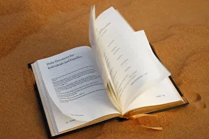 Prayer book on sand, Dubai, United Arab Emirates, Middle East Prayer book on sand, Dubai, United Arab Emirates, Middle East
