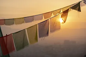 Kathmandu Valley Gallery: Prayer flags at Swayambhunath (Monkey Temple) in front of the city at sunrise, Kathmandu