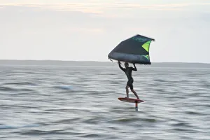 Pro surfer James Jenkins flies above the Atlantic Ocean on his wing surfer at Nags Head Pro surfer James Jenkins flies above the Atlantic Ocean on his wing surfer at Nags Head