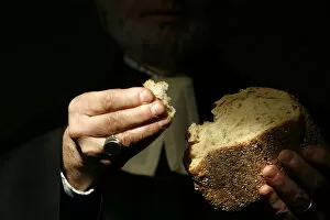 Images Dated 5th February 2007: Protestant minister holding Communion bread, Geneva, Switzerland, Europe